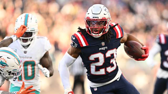 Jan 1, 2023; Foxborough, Massachusetts, USA; New England Patriots safety Kyle Dugger (23) runs for a touchdown after intercepting the ball during the second half of agame against the Miami Dolphins at Gillette Stadium.